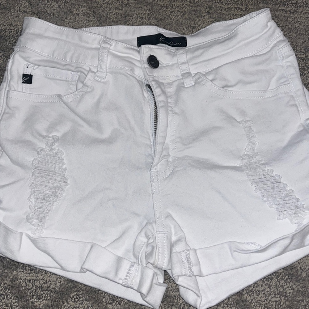 White ripped jean shorts